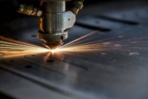 Laser cutting through metal